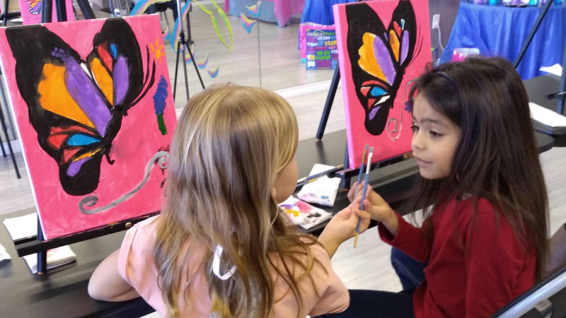 Cute kids paint together